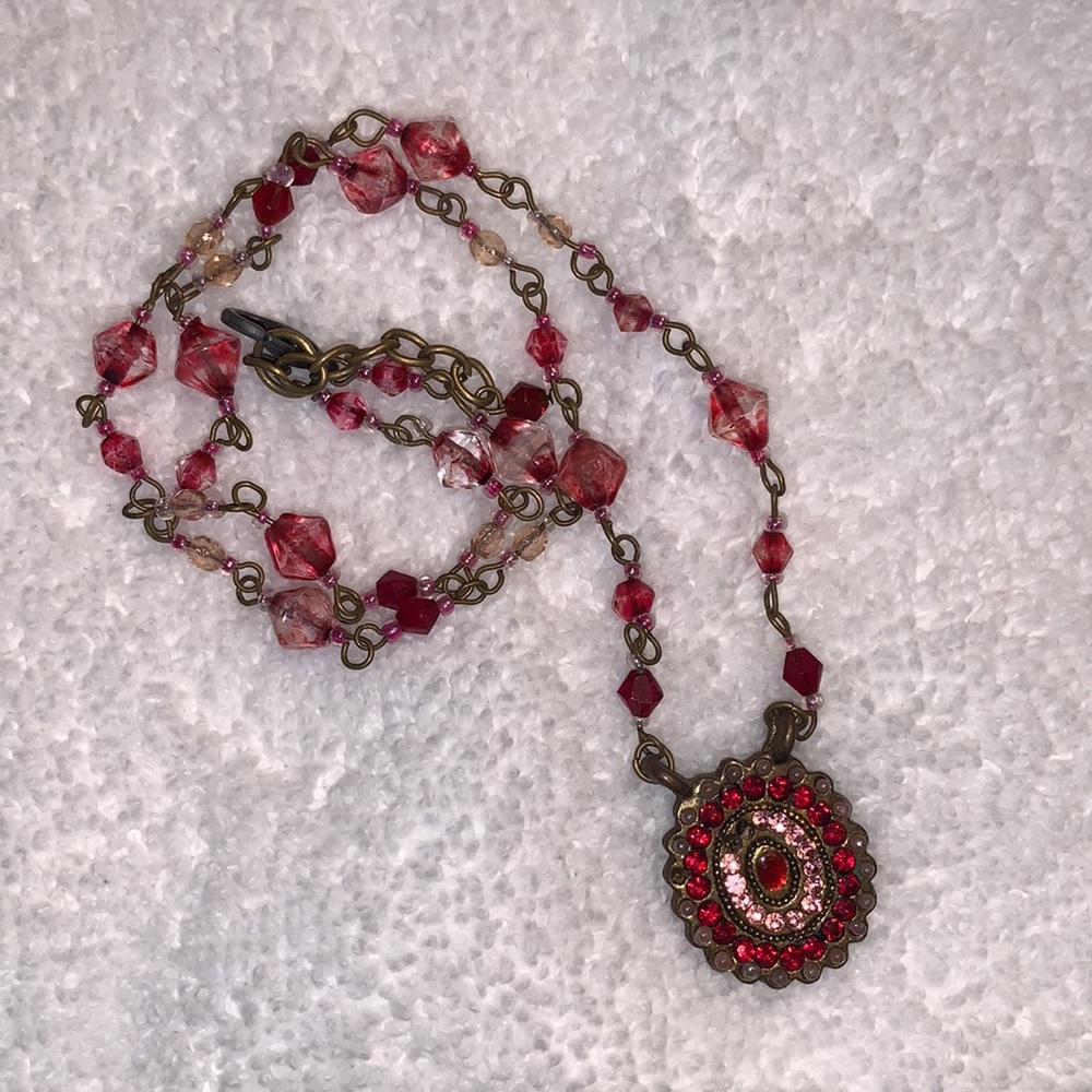 Pink & red beaded necklace with medallion